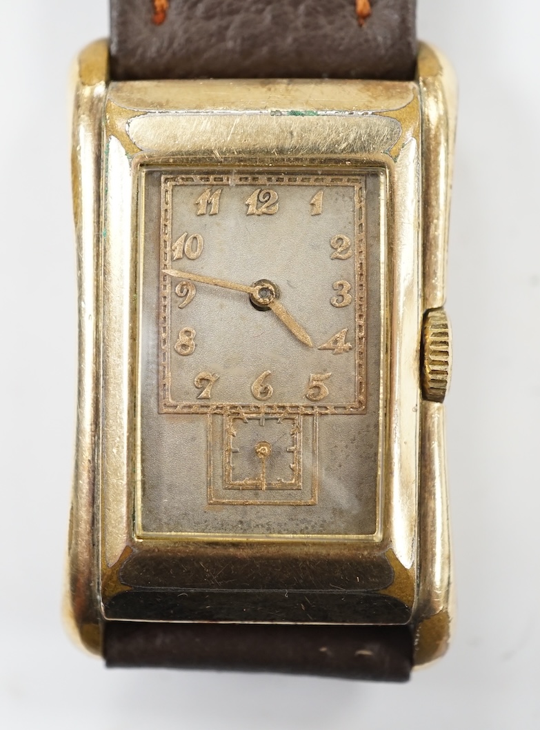 A gentleman's vintage Gruen 'Prince-style' wrist watch, in gilt case engraved 'Rolex 14k gold filled', with silvered dial, raised gilt arabic numerals and subsidiary seconds. The movement with the original Gruen naming d